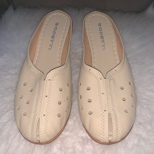 Cream color mules with slight peep toe